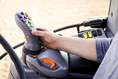 Man using guidance steering on a piece of agricultural equipment