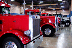 Garage filled with red semi trucks