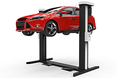 Red sedan in the air on an automotive hydraulic lift