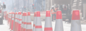 Color faded image of a row of traffic cones on a street under construction