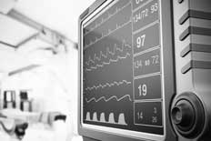 Screen of a patient vital signs monitor in hospital room