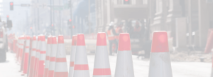 Color faded image of a row of traffic cones on a street under construction